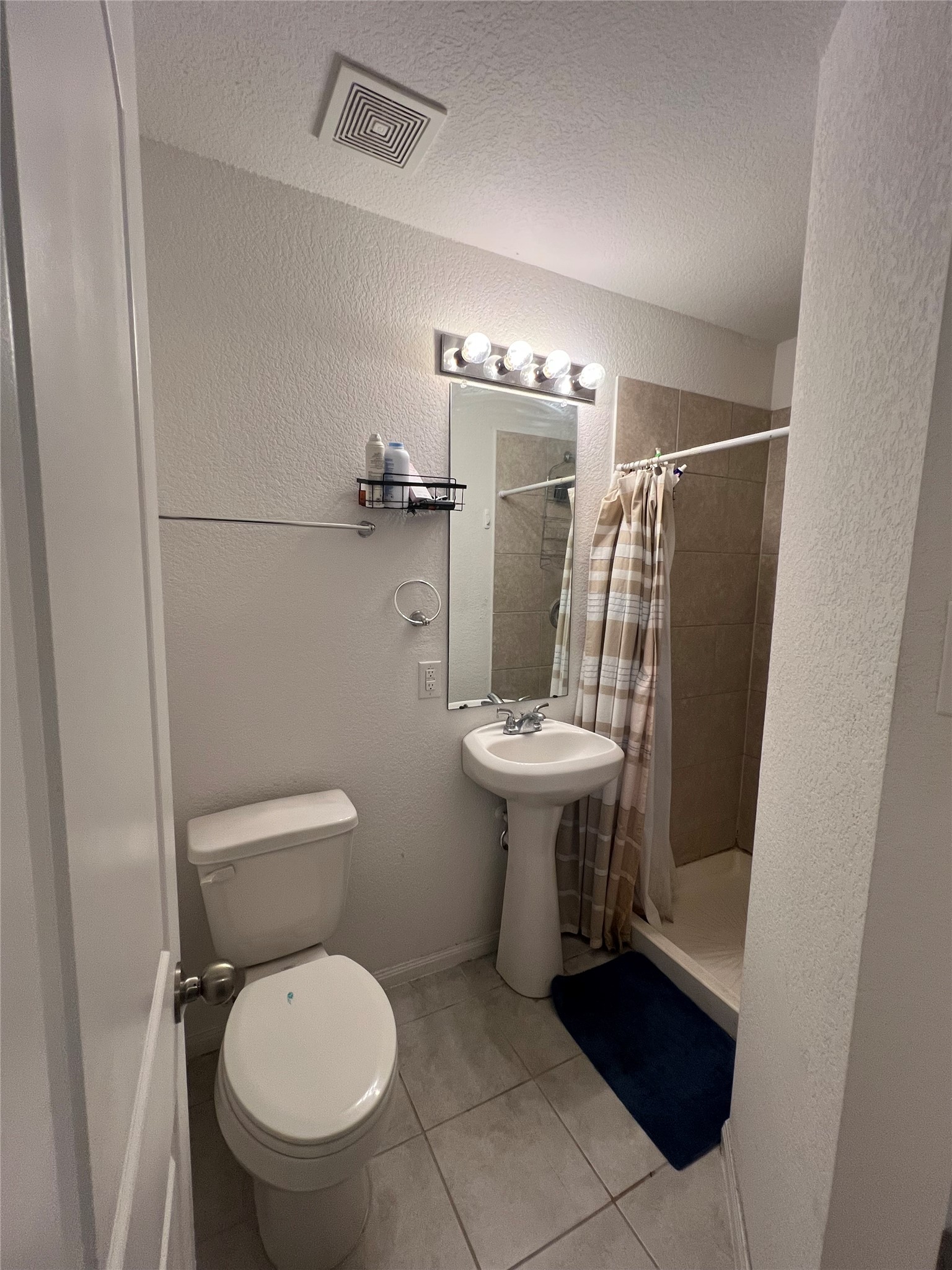 4139 Sam Houston Road Willis, TX 77378 - Photo 15 of 26 Ensuite bath for Bedroom 1 has stand-up shower.