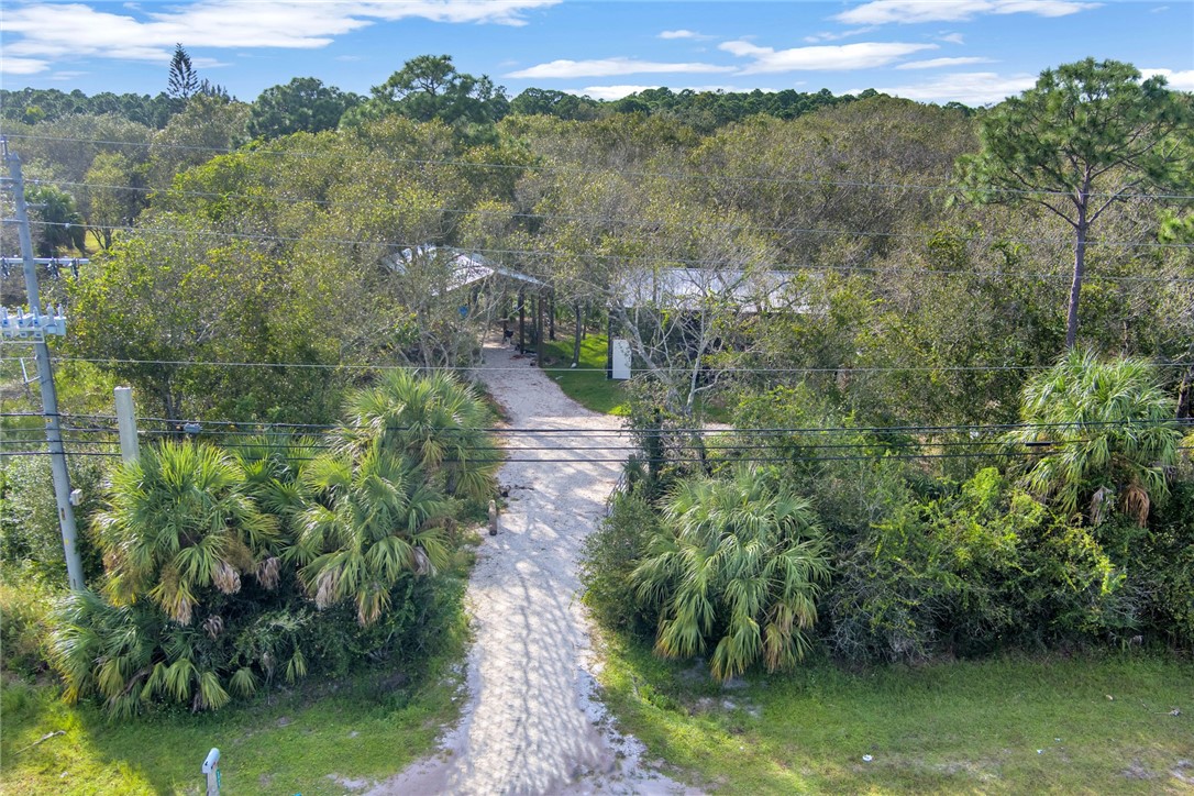 2465 Johnston Road Fort Pierce, FL 34951 - Photo 16 of 17 an aerial view of a house with a yard