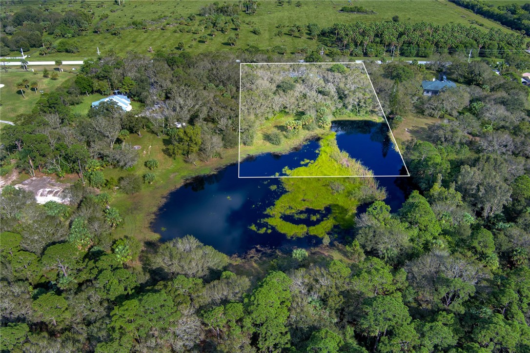 2465 Johnston Road Fort Pierce, FL 34951 - Photo 9 of 17 an aerial view of a house with a yard