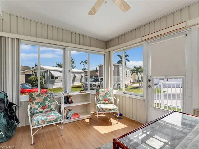 a room with lots of wooden floor and furniture