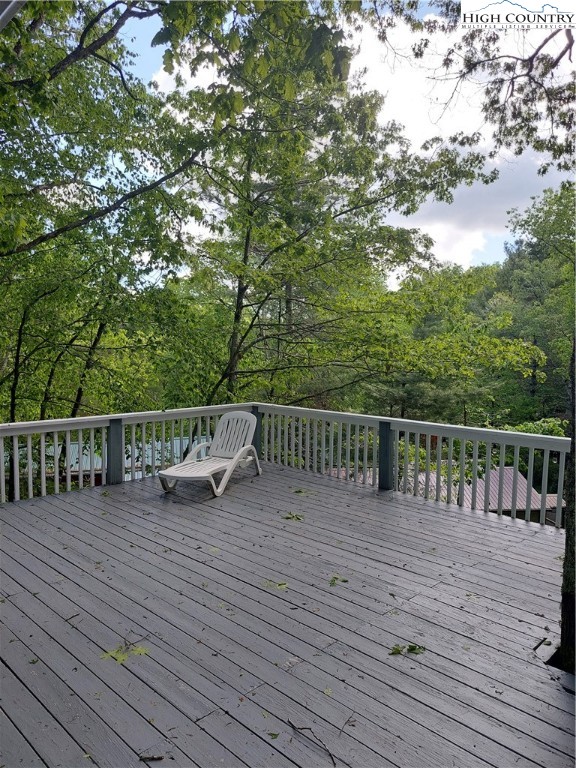 111 Longview Road Newland, NC 28657 - Photo 5 of 35 a view of deck of house with wooden floor and fence