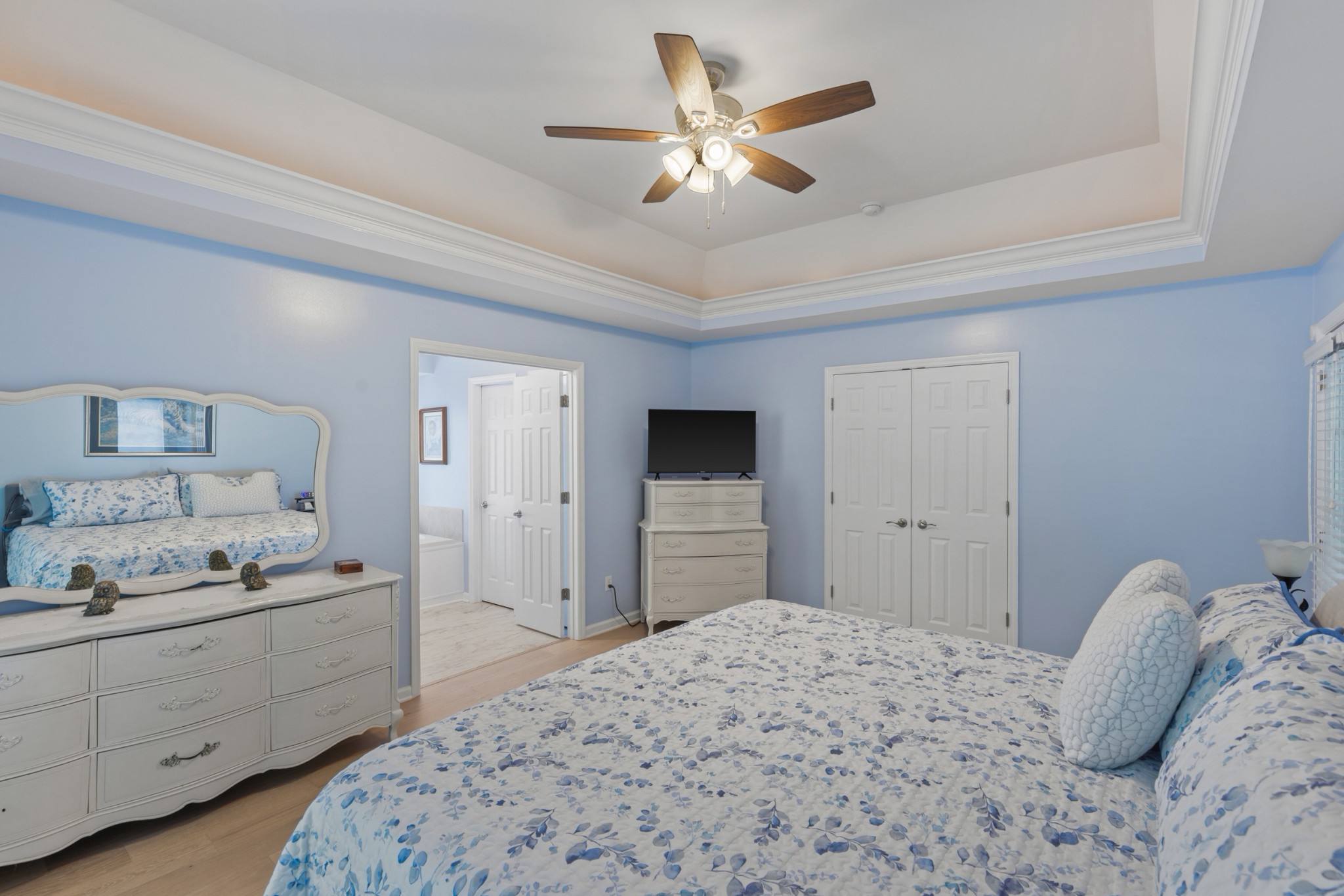 454 Campbell Hollow Road Bethpage, TN 37022 - Photo 29 of 57 a bedroom with a bed and a chandelier