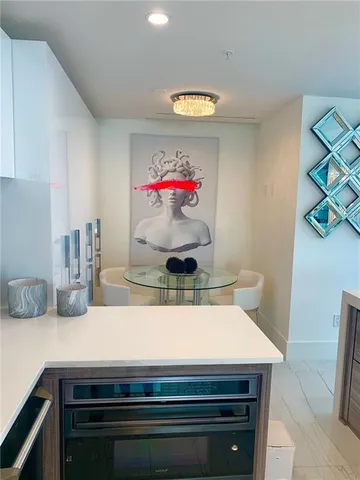 a kitchen with a stove and cabinets