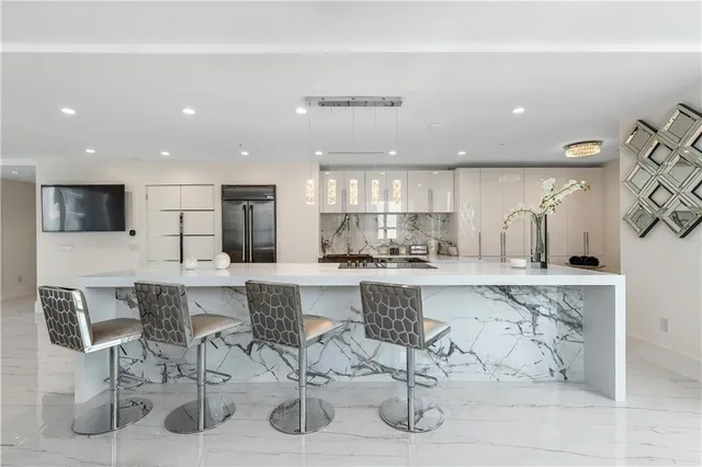 a view of a kitchen and dining room