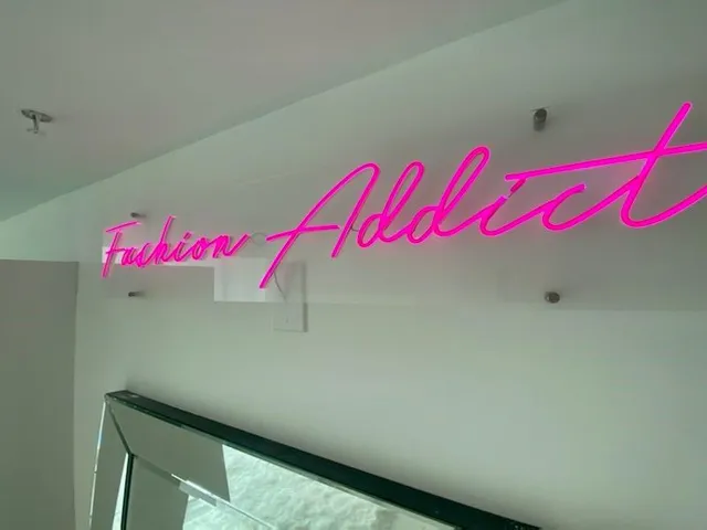 a bathroom with a double vanity sink mirror and shower
