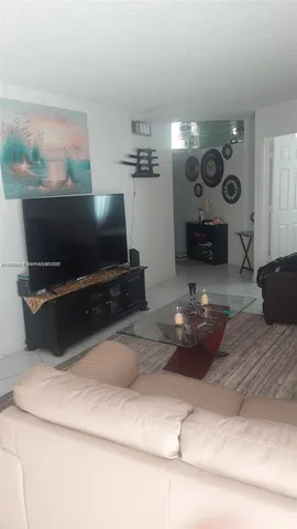a bedroom with furniture and a couch