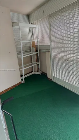 a view of a workspace with furniture and a couch