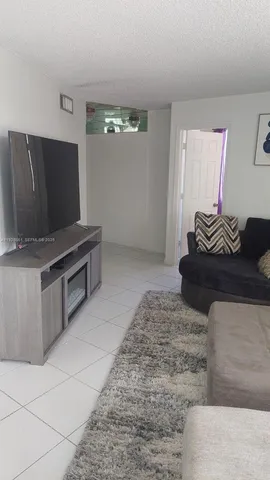 a living room with couches and a couch