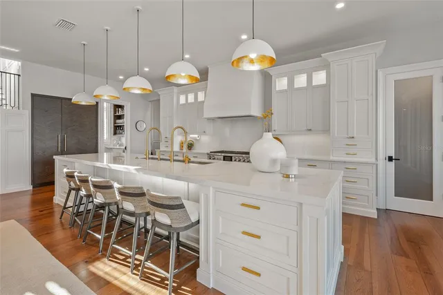 a dining room with furniture and chandelier