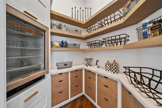 a kitchen with center island table and chairs in it