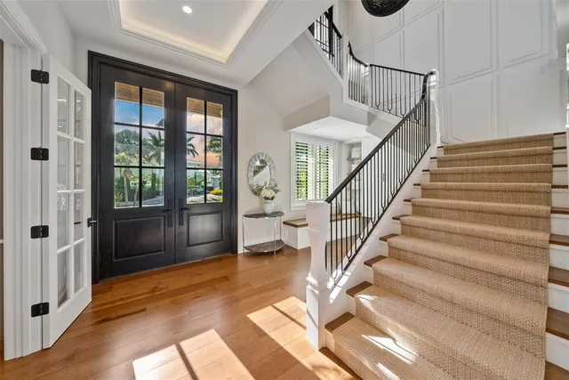 a view of a lake with couches in the patio