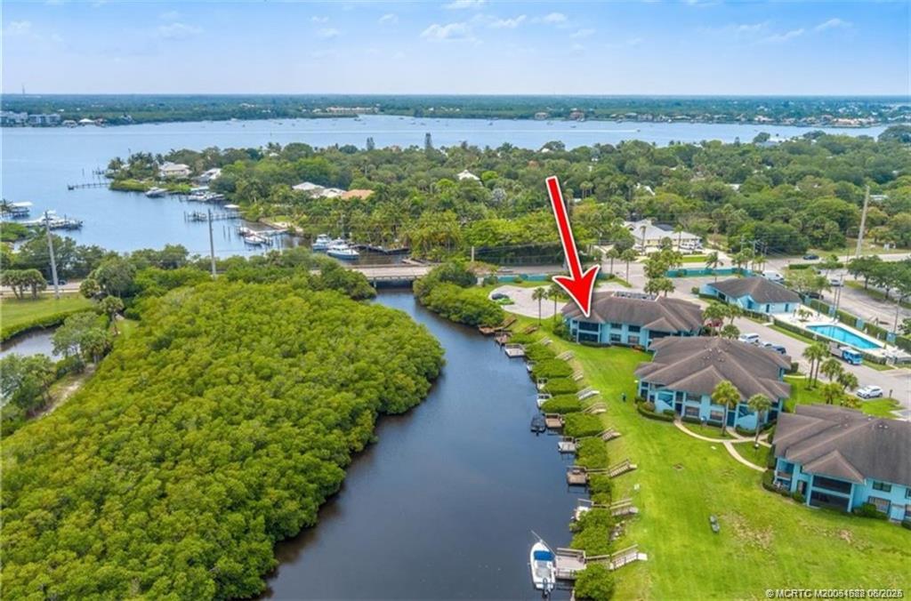 950 South Kanner Highway, Unit 101 Stuart, FL 34994 - Photo 4 of 32 an aerial view of residential houses with outdoor space and swimming pool