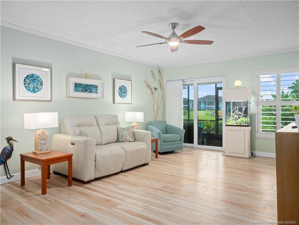 950 South Kanner Highway, Unit 101 Stuart, FL 34994 - Photo 7 of 32 a living room with furniture and a large window