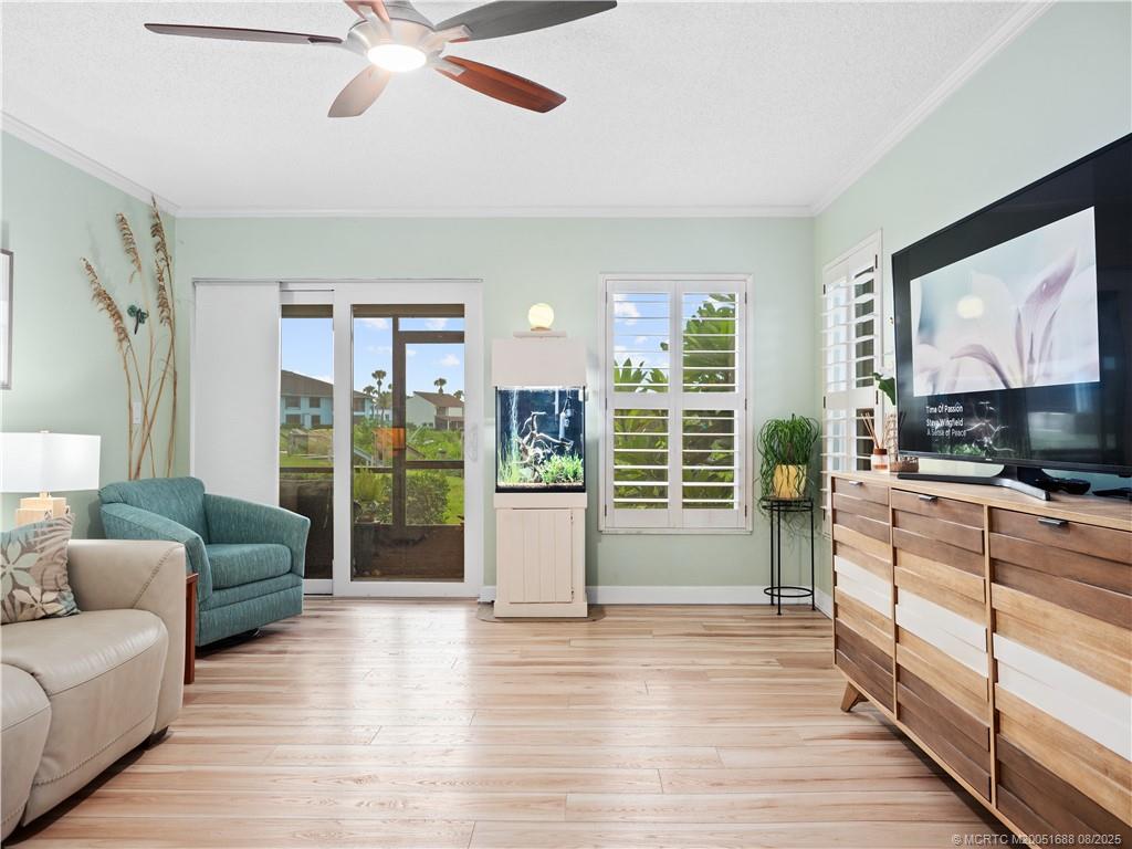 950 South Kanner Highway, Unit 101 Stuart, FL 34994 - Photo 9 of 32 a living room with furniture and a flat screen tv