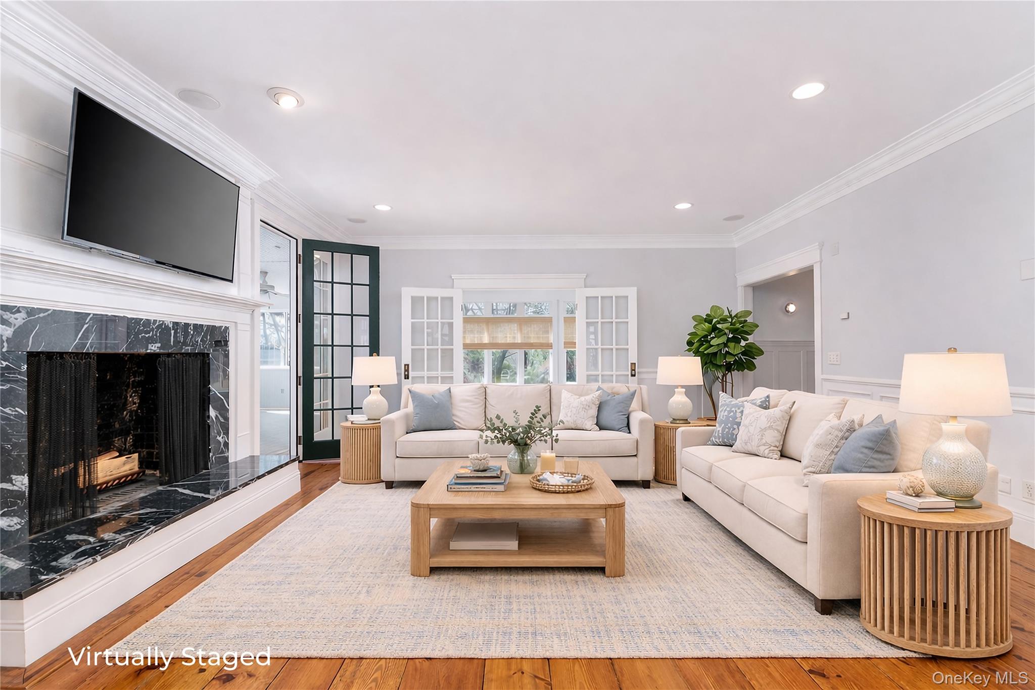 9 Old Field Road Setauket, NY 11733 - Photo 17 of 50 Generously Proportioned Den With Wood Burning Fireplace With Pocket Doors To Kitchen and French Doors To Sunroom and Enclosed Porch.