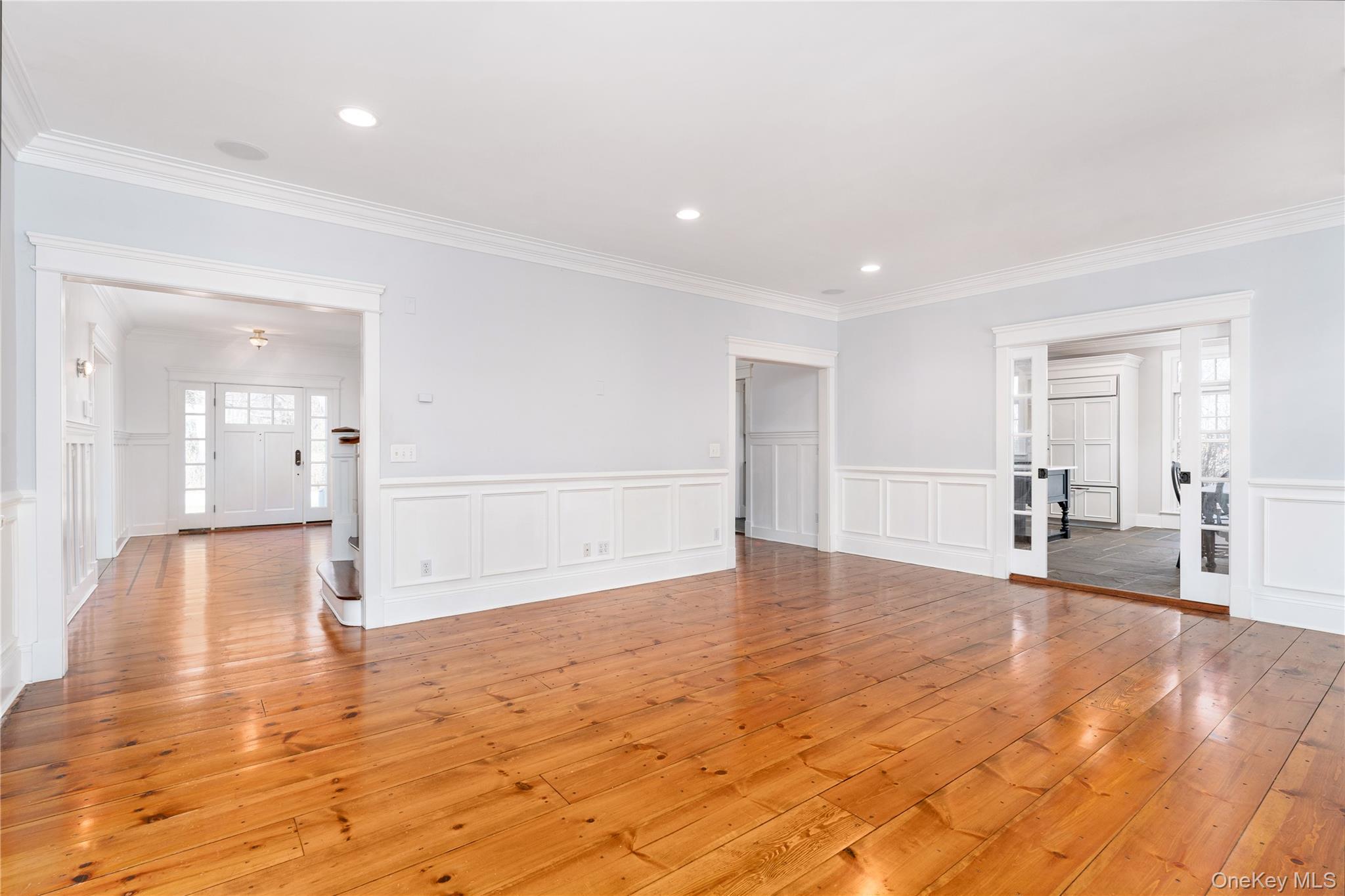 9 Old Field Road Setauket, NY 11733 - Photo 19 of 50 Generously Proportioned Den With Wood Burning Fireplace With Pocket Doors To Kitchen and French Doors To Sunroom and Enclosed Porch.