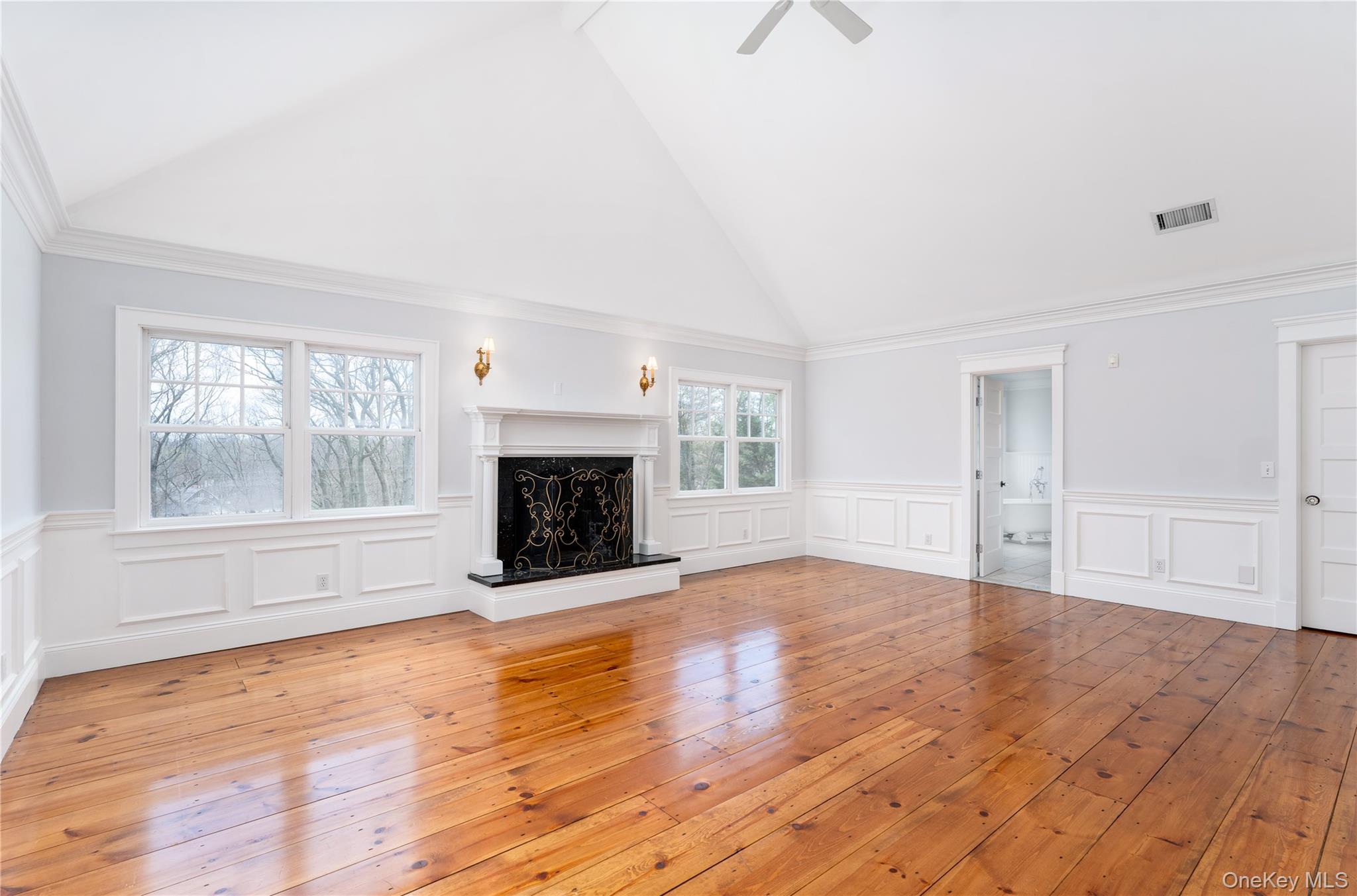 9 Old Field Road Setauket, NY 11733 - Photo 29 of 50 Luxurious Primary Bedroom Suite With Vaulted Ceiling, Fireplace & Windows Overlooking Yard & Pond, His & Hers Walk-In Closets & Marble En-Suite Bathroom