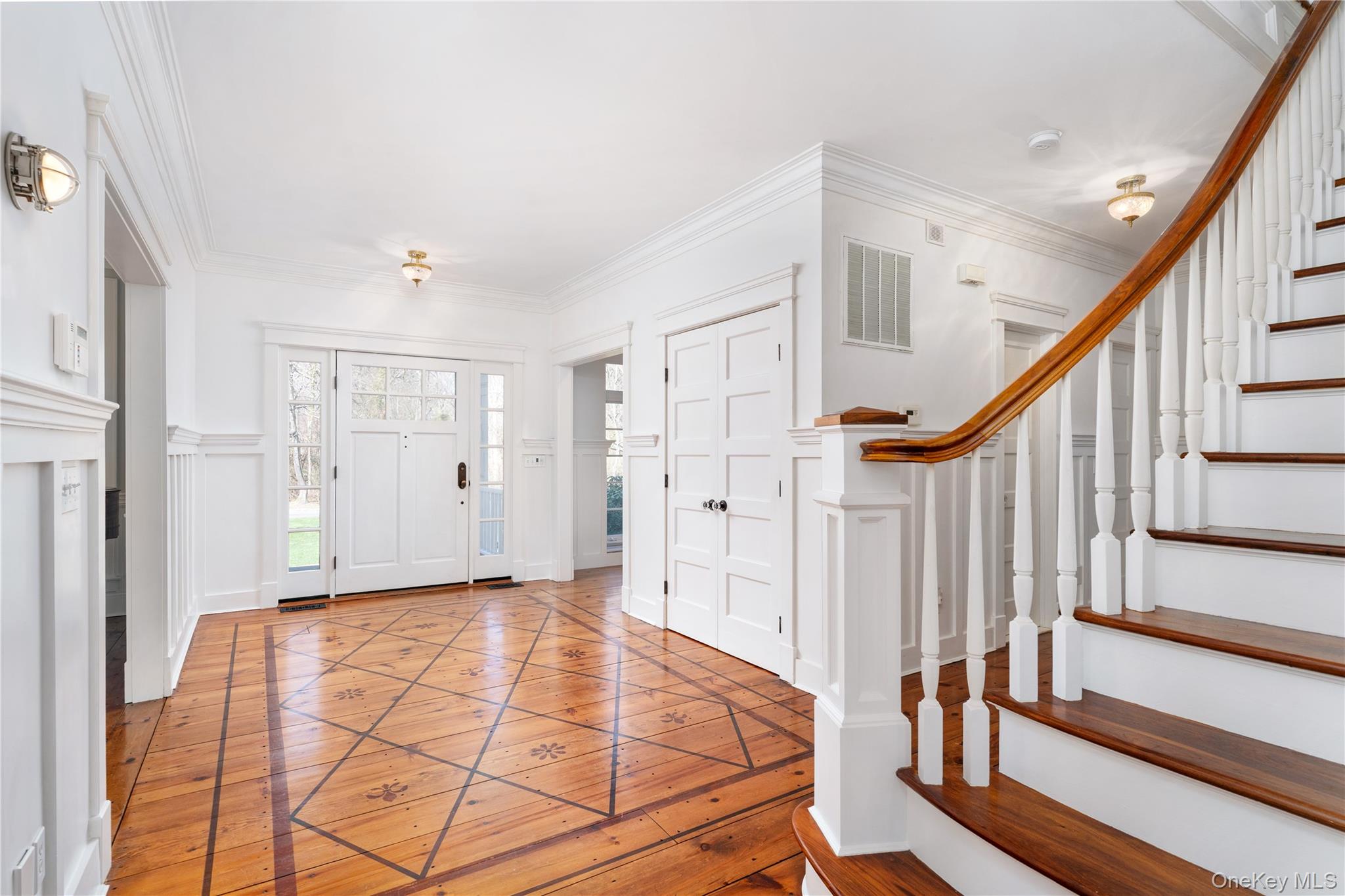 9 Old Field Road Setauket, NY 11733 - Photo 9 of 50 Welcoming Entry Foyer With Gleaming Hardwood Floors.