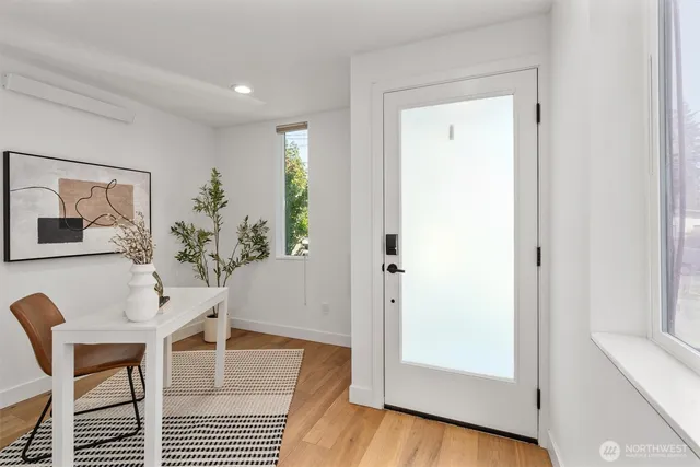 a view of a livingroom with furniture and wooden floor