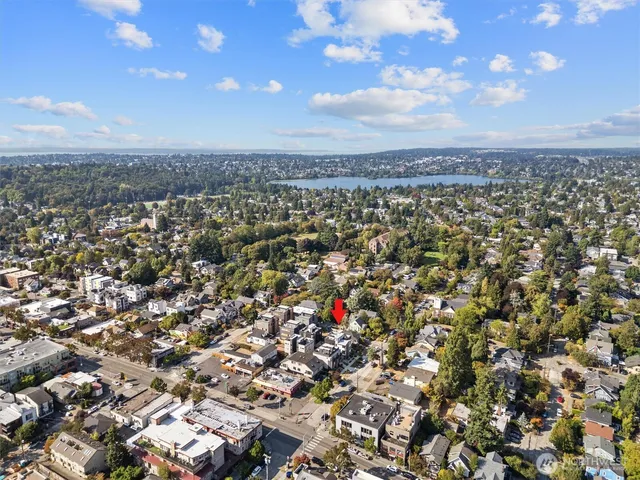 a view of a brick building next to a yard