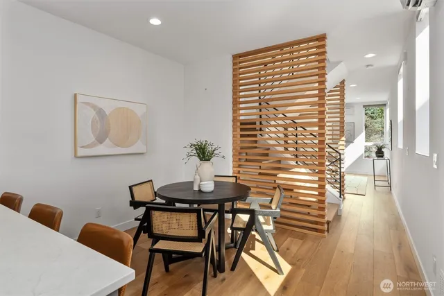 a view of a dining room with furniture and wooden floor