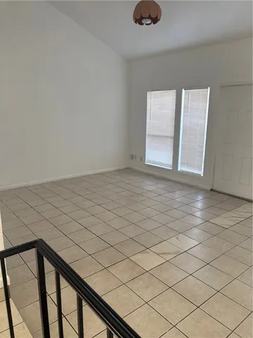 a view of an empty room and window