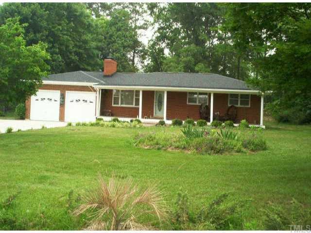 1312 Pagan Road Raleigh, NC 27603 - Photo 1 of 1 a front view of house with yard and green space