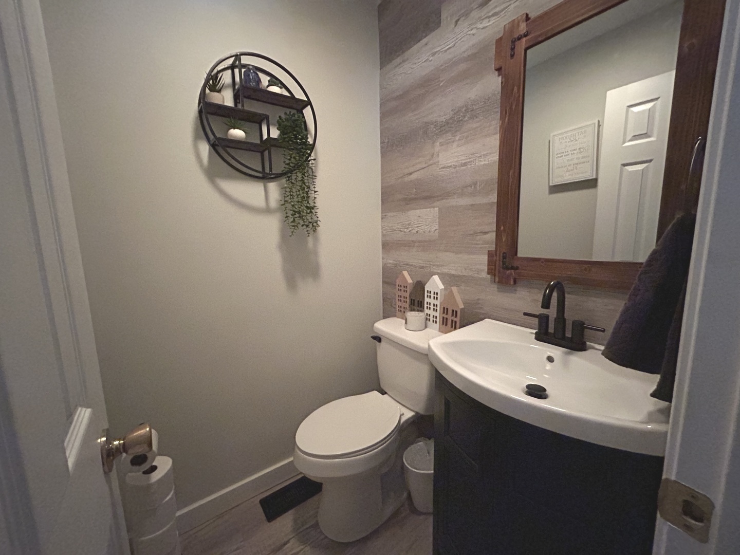 53 Mariner Lane North, Unit 53 Fox Lake, IL 60020 - Photo 13 of 30 a bathroom with a toilet sink vanity and mirror