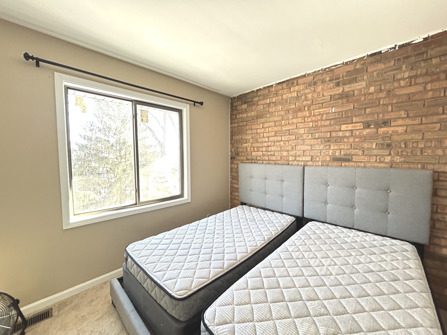 53 Mariner Lane North, Unit 53 Fox Lake, IL 60020 - Photo 20 of 30 a bedroom with a bed and a window