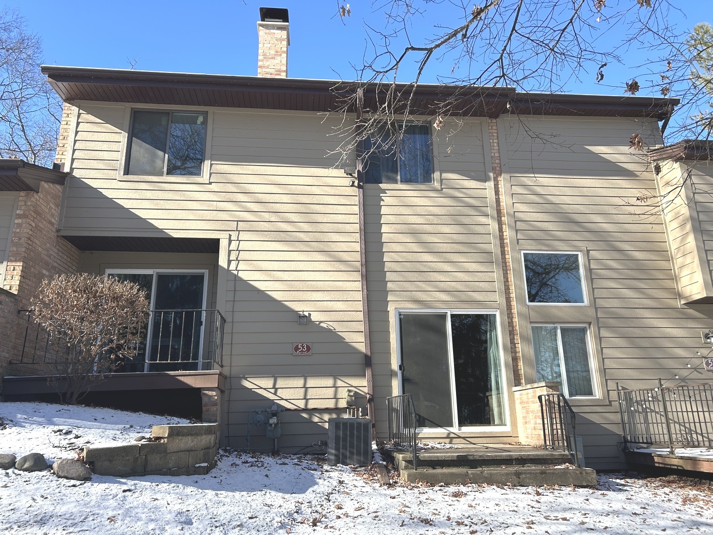 53 Mariner Lane North, Unit 53 Fox Lake, IL 60020 - Photo 23 of 30 a view of a house with a door and wooden fence