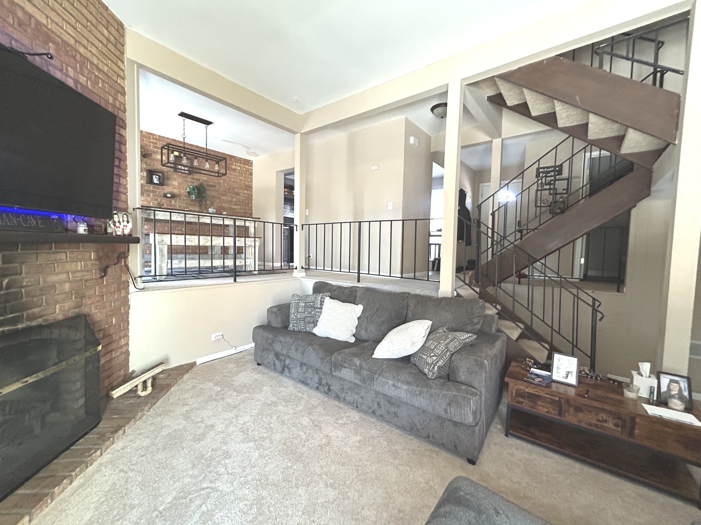 53 Mariner Lane North, Unit 53 Fox Lake, IL 60020 - Photo 10 of 30 a living room with furniture and a flat screen tv