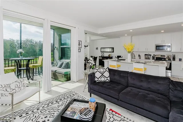 a view of a dining room with furniture and window