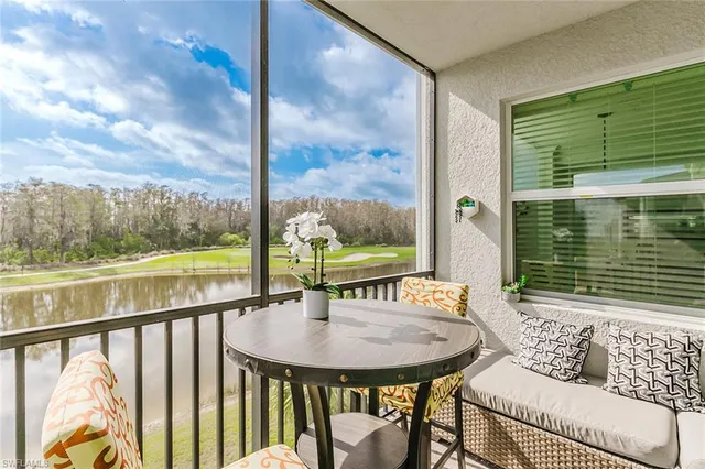 a view of a chairs and table in patio