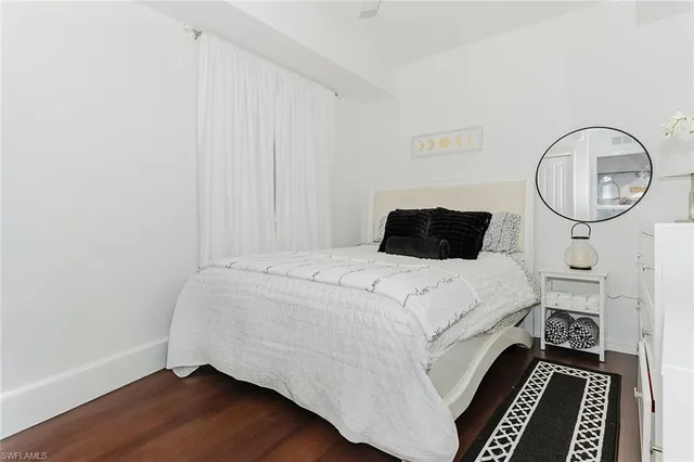 a bed room with a bed and a dresser