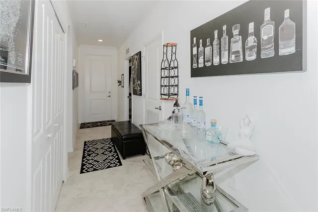 a view of a hallway with seating area