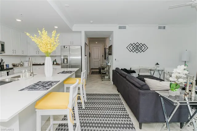 a kitchen with a sink a stove and refrigerator
