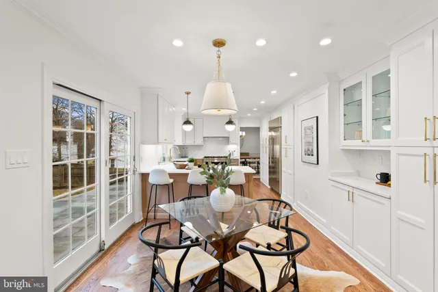 a living room with furniture a fireplace and next to ceiling window