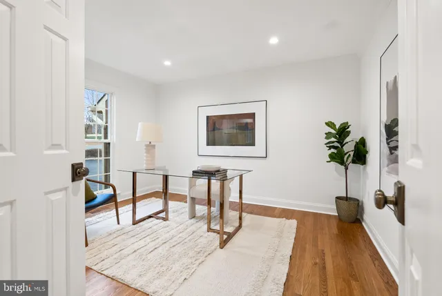 a spacious bedroom with a bed and a chandelier