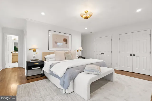 a bathroom with a granite countertop sink toilet tub and shower