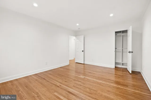 a roof deck with couches and a fire pit