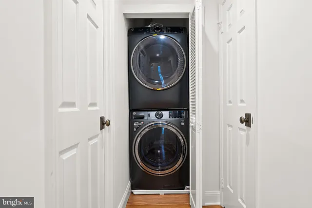 a view of a house with snow on the side of the road