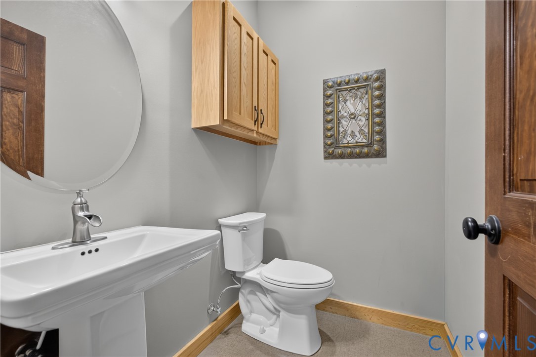 1292 Mohawk Road Long Island, VA 24569 - Photo 27 of 95 Pedestal sink with a brushed nickel faucet and an