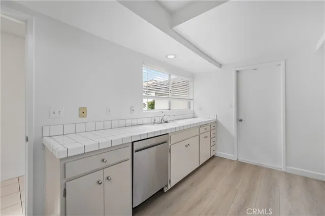 a view of a bathroom with sink and mirror