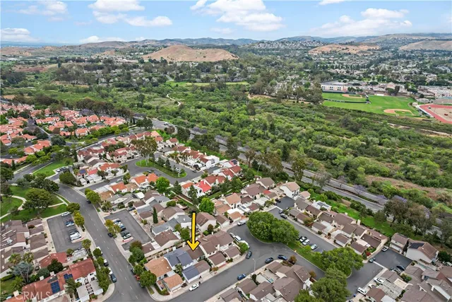 an aerial view of a house with a garden