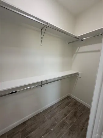 a view of an empty walk in closet