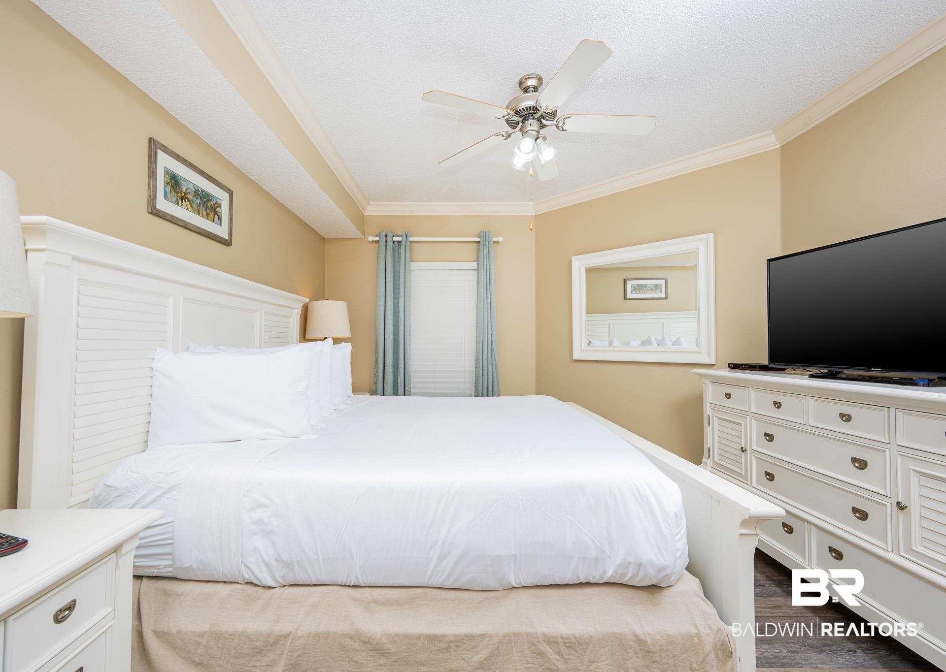 27580 Canal Road, Unit 1429 Orange Beach, AL 36561 - Photo 9 of 45 Bedroom with crown molding, dark wood-type flooring, a ceiling fan, and a textured ceiling