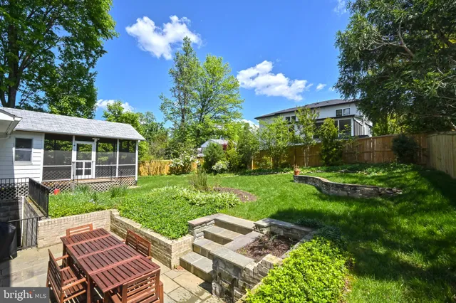 a view of a house with backyard porch and garden