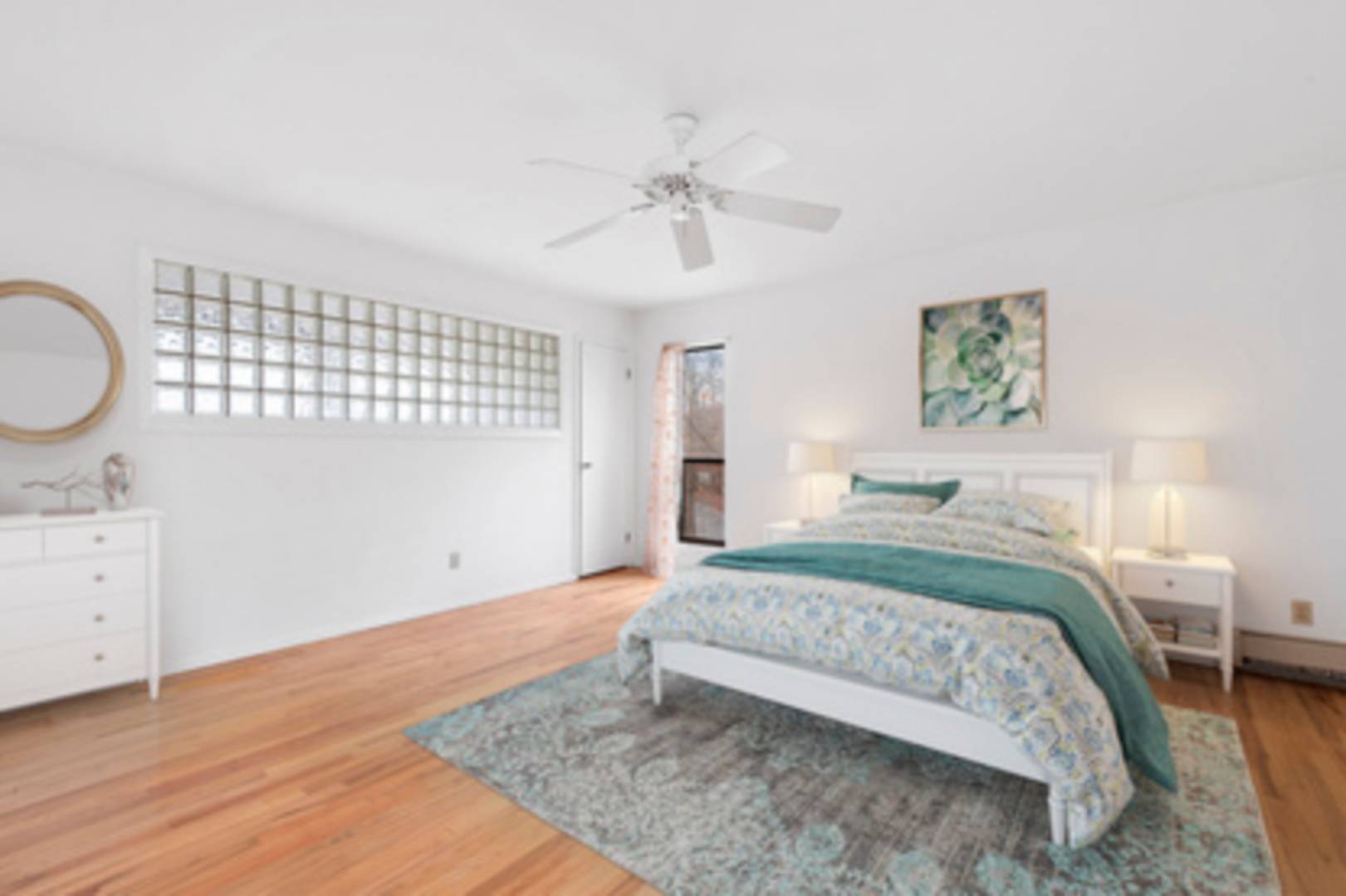 141 Roses Grove Road Southampton, NY 11968 - Photo 4 of 10 a bedroom with a bed and a dresser