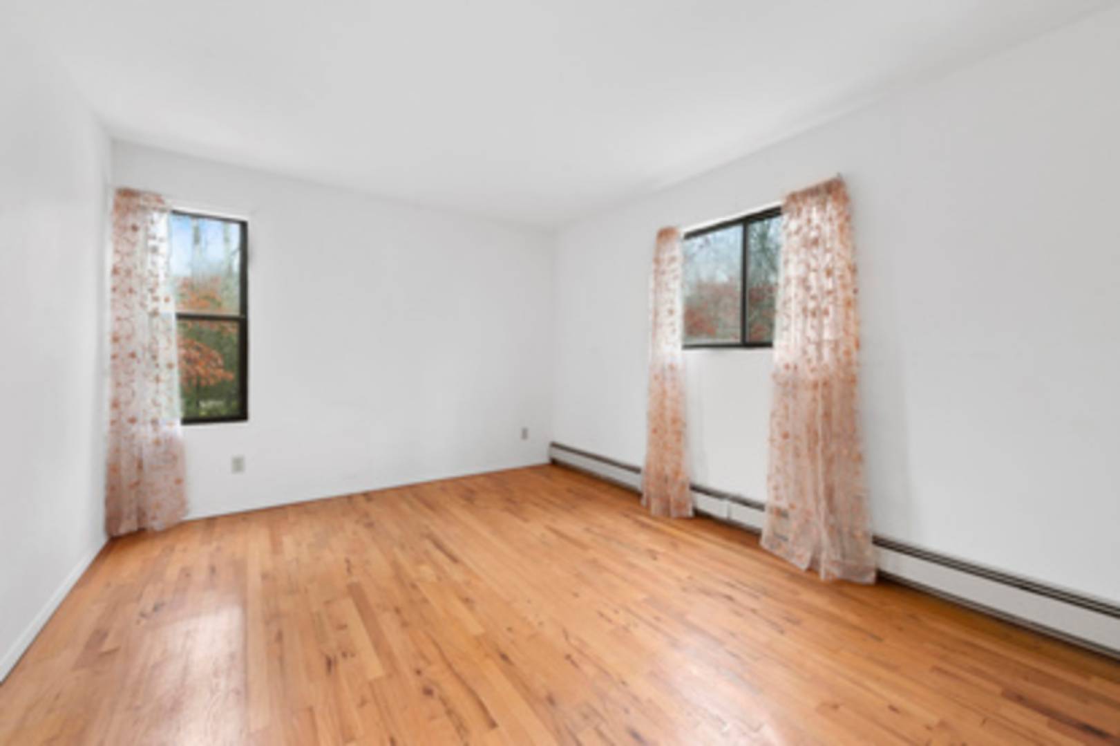 141 Roses Grove Road Southampton, NY 11968 - Photo 6 of 10 an empty room with window