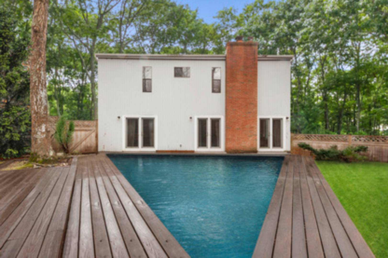 141 Roses Grove Road Southampton, NY 11968 - Photo 9 of 10 a view of a house with backyard